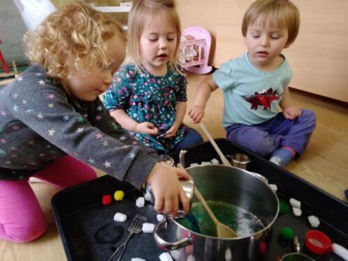 Learning to measure and mix magic potions at Gower Day Nursery 