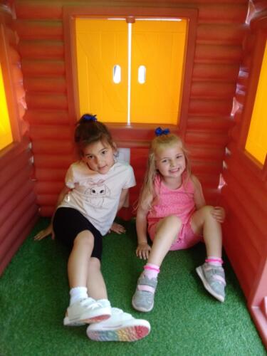 Playing in the Wendy House at Gower Day Nursery