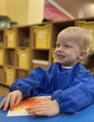 Making a fire painting at Gower Day Nursery