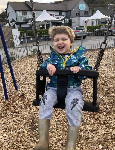 Lots of fun swinging in the park at Gower Day Nursery