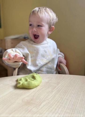 Getting stuck into playdough at Gower Day Nursery