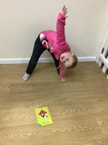 Learning yoga poses at Gower Day Nursery